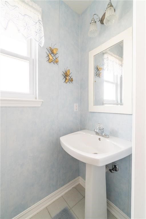 bathroom featuring tile patterned flooring and a wealth of natural light