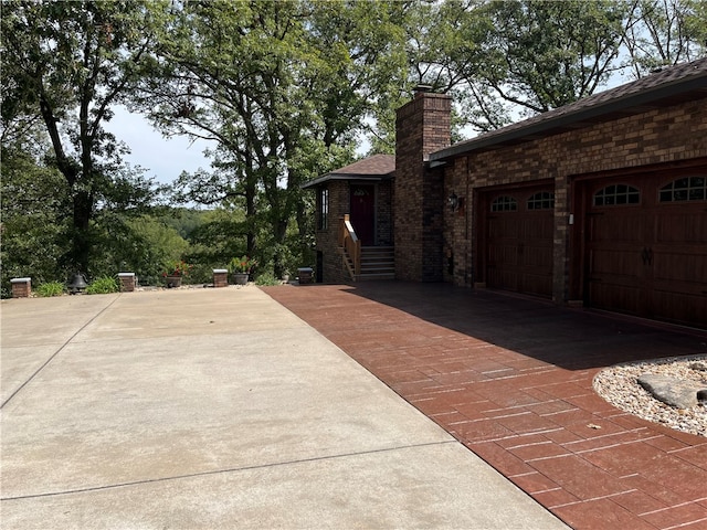 view of side of property featuring a garage