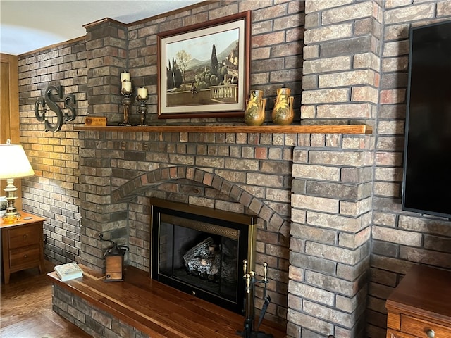 unfurnished living room with a fireplace and dark wood-type flooring