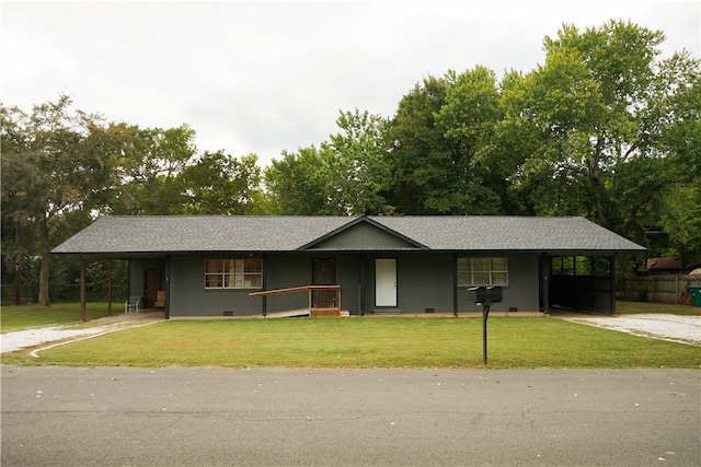 ranch-style house with a front lawn and a carport