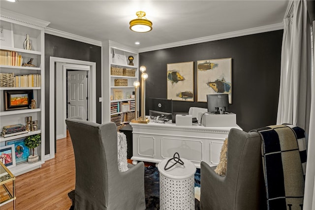 office featuring crown molding and light hardwood / wood-style floors