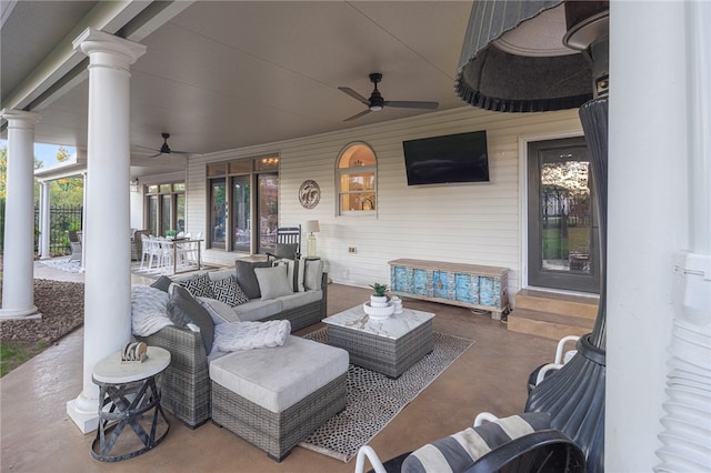 view of patio with ceiling fan and an outdoor living space