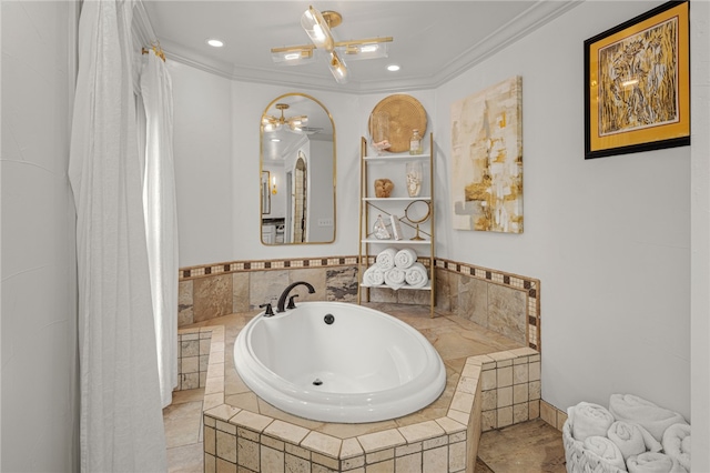 bathroom with ornamental molding and a relaxing tiled tub