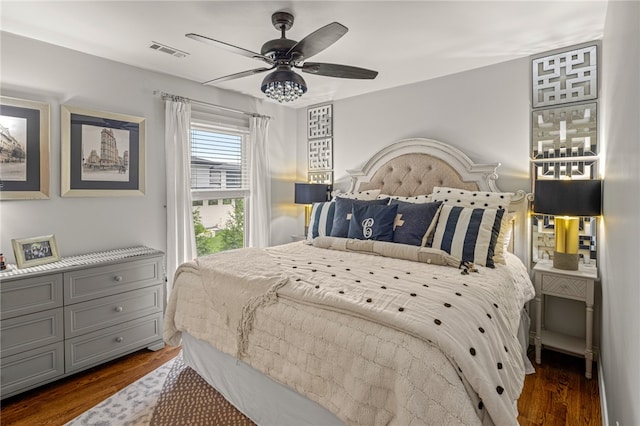 bedroom featuring ceiling fan and dark hardwood / wood-style flooring