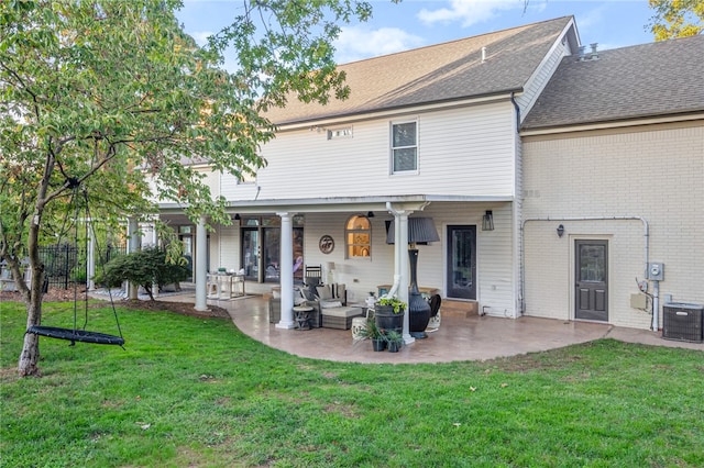 rear view of house featuring an outdoor hangout area, a yard, cooling unit, and a patio area