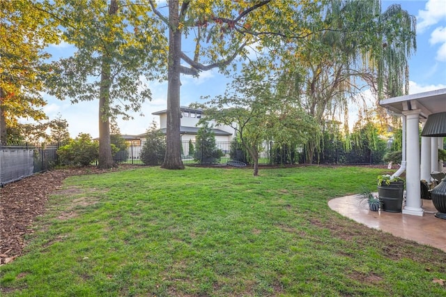 16 W Wimbledon Way, Rogers, AR 72758 - view of yard featuring a fenced backyard and a patio
