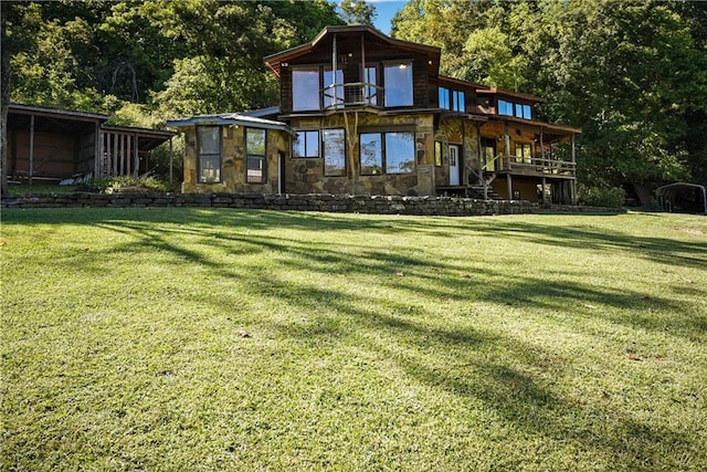 rear view of house with a yard