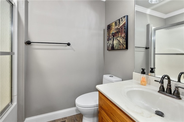 bathroom featuring hardwood / wood-style floors, vanity, ornamental molding, and toilet