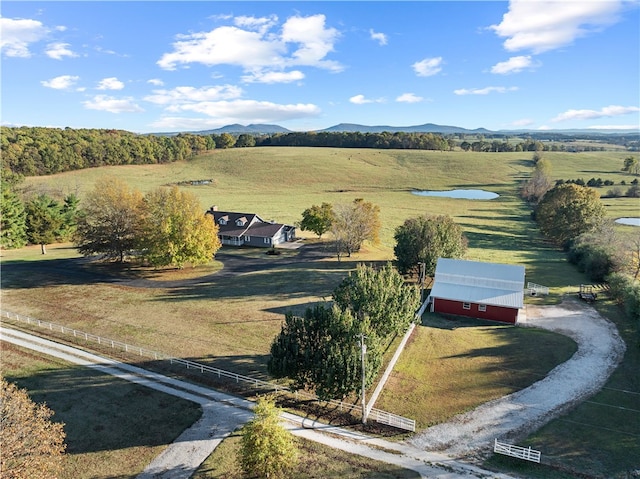 birds eye view of property featuring a mountain view and a rural view