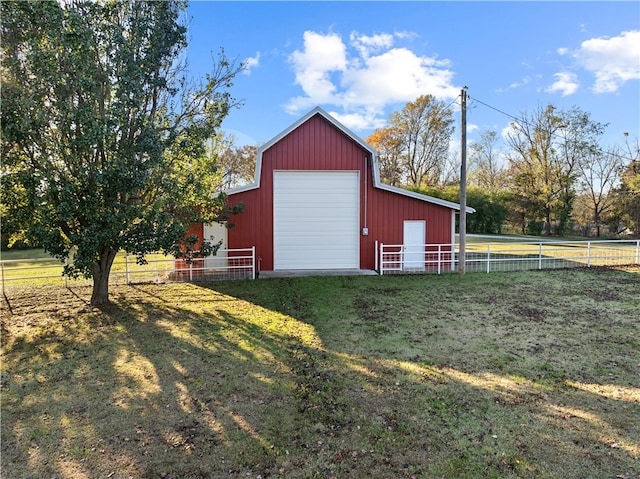 view of outbuilding featuring a yard and a garage