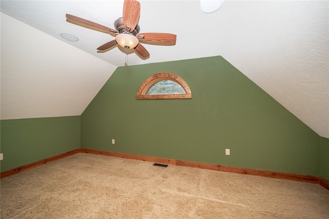 bonus room with lofted ceiling and ceiling fan