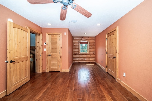 foyer with dark hardwood / wood-style flooring and ceiling fan