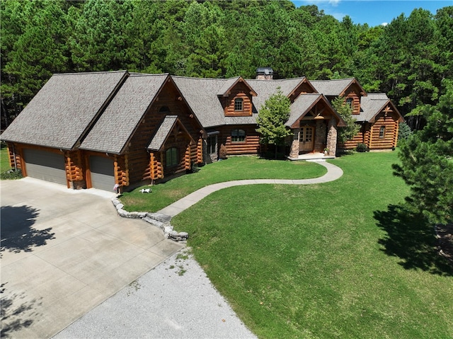 log home featuring a front yard and a garage