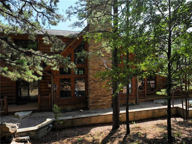 view of property exterior featuring covered porch