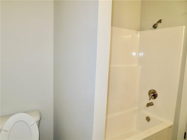 full bathroom with bathing tub / shower combination and toilet