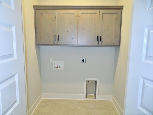 laundry area featuring electric dryer hookup, baseboards, cabinet space, and washer hookup