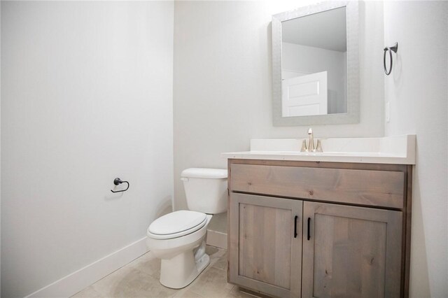 304 Doral Dr, Cave Springs, AR 72718 - half bathroom with vanity, toilet, baseboards, and tile patterned floors