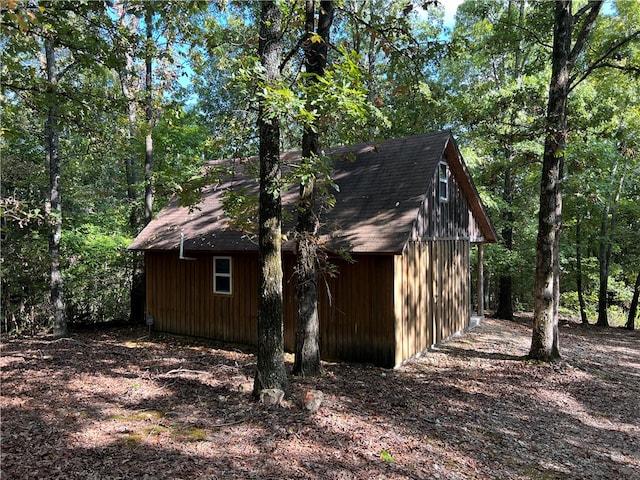 view of side of property with an outbuilding