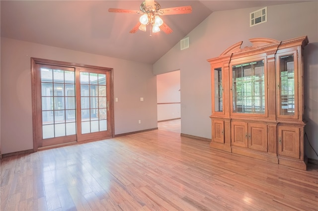 unfurnished room with vaulted ceiling, ceiling fan, and light hardwood / wood-style floors