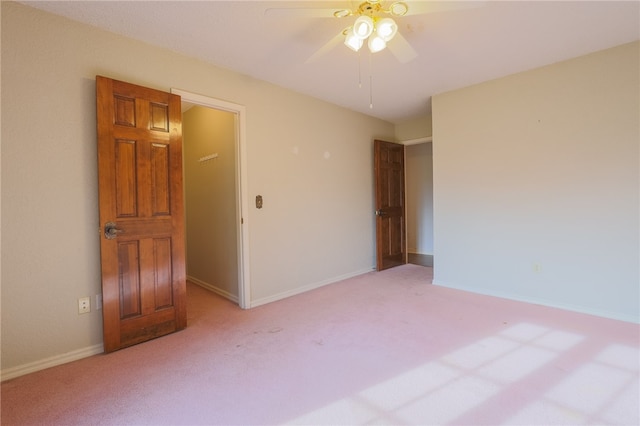 unfurnished bedroom with ceiling fan and light carpet