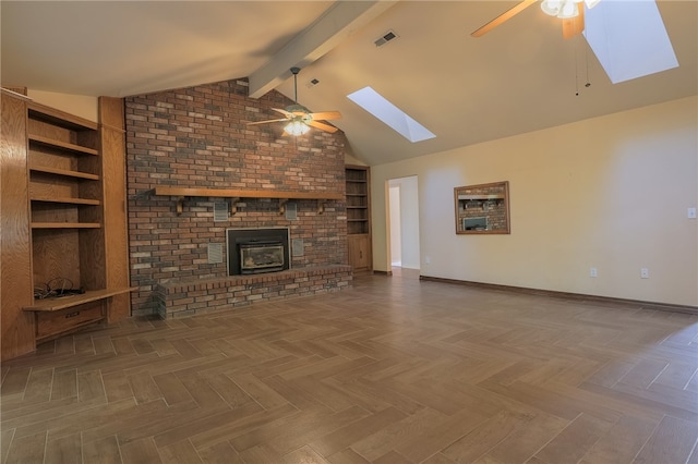 unfurnished living room with parquet flooring, vaulted ceiling with skylight, ceiling fan, and a brick fireplace