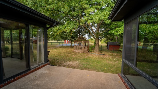 view of yard featuring a gazebo and a patio area