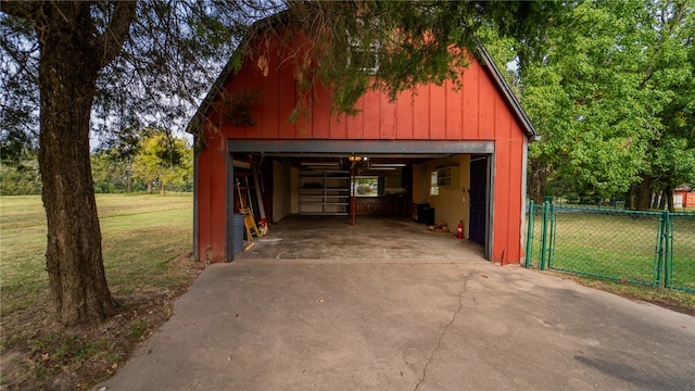 garage featuring a lawn