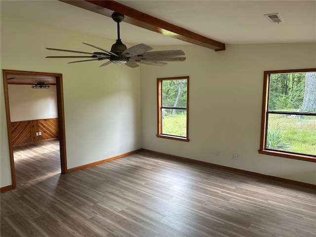 unfurnished room with lofted ceiling with beams, ceiling fan, and hardwood / wood-style flooring