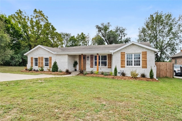 ranch-style house with a front lawn