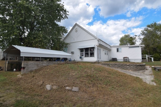 541 County Road 211, Eureka Springs, AR 72632 - back of house featuring a carport and central AC