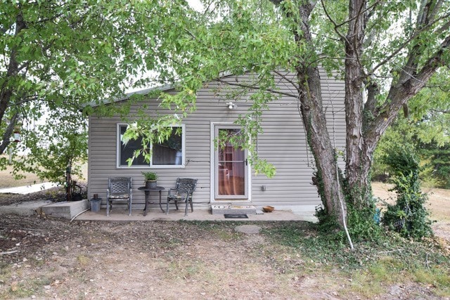 back of property with a patio