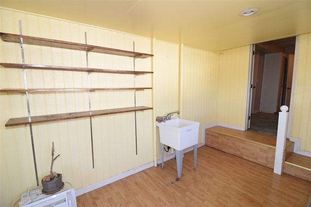 basement featuring light wood-style floors