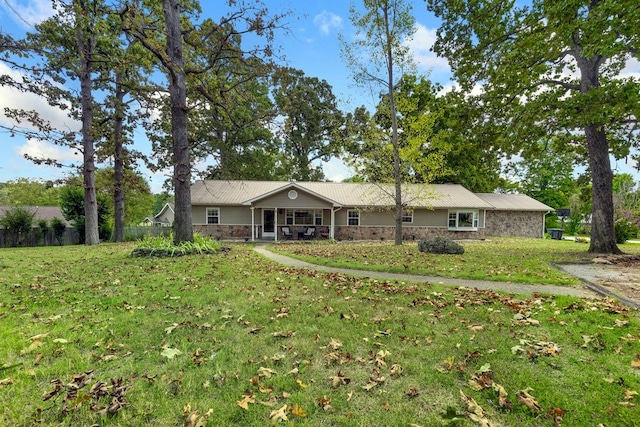 ranch-style house with a front lawn