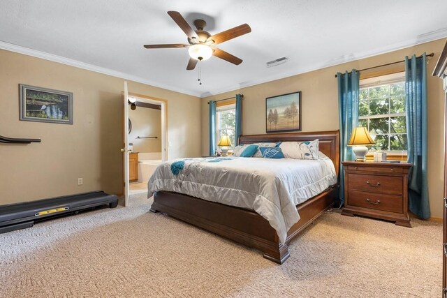bedroom with visible vents, multiple windows, and light colored carpet