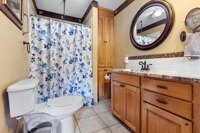 full bathroom with tile patterned flooring, vanity, toilet, a shower with shower curtain, and decorative backsplash