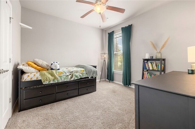 carpeted bedroom featuring ceiling fan