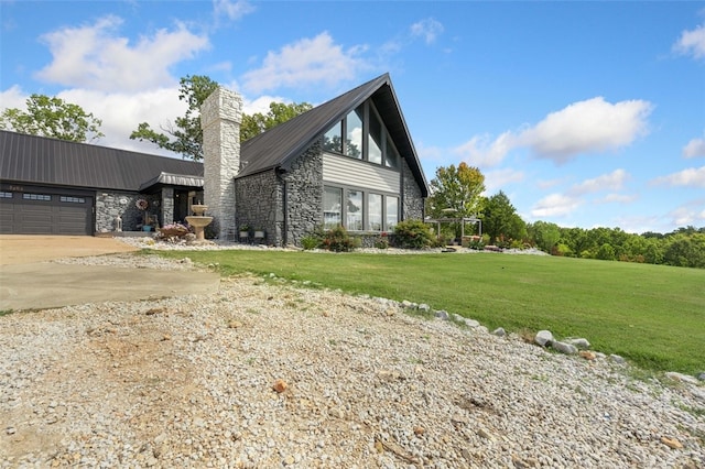 view of property exterior with a yard and a garage