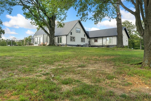 exterior space featuring a front yard and a gazebo