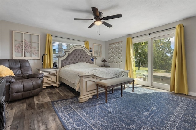 bedroom with ceiling fan, dark hardwood / wood-style floors, multiple windows, and access to outside