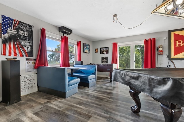 game room with a healthy amount of sunlight, dark hardwood / wood-style flooring, and billiards