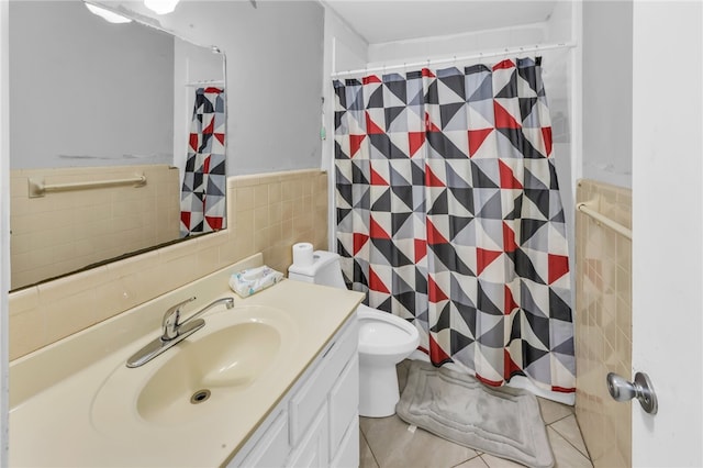 bathroom featuring tile walls, a shower with shower curtain, tile patterned floors, vanity, and toilet