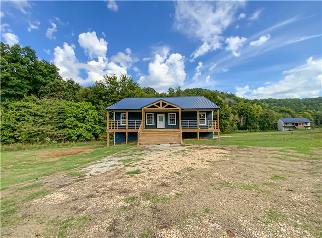 view of front of property featuring a deck and french doors