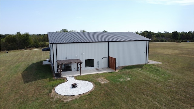 view of outbuilding featuring a lawn