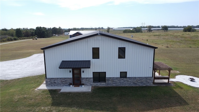 view of outbuilding featuring a yard