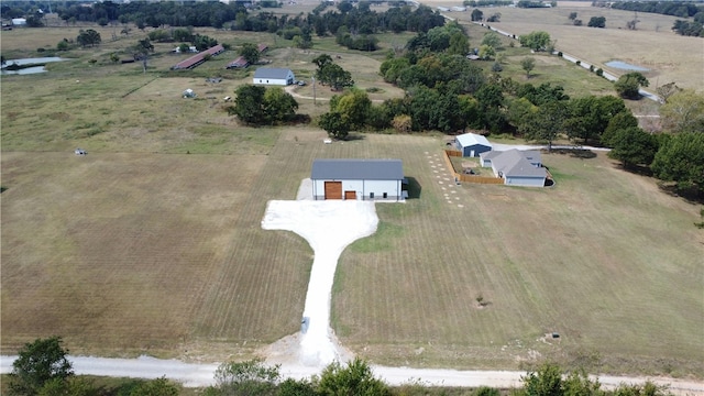 birds eye view of property with a rural view