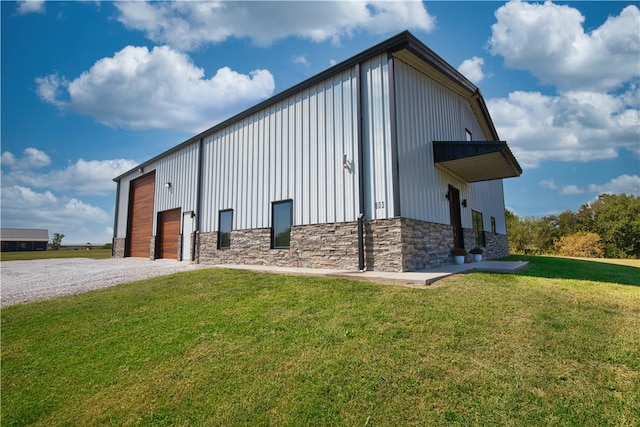 view of outbuilding featuring a yard