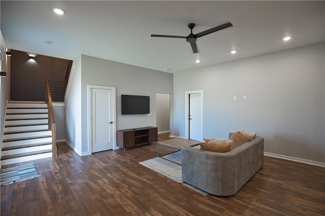 unfurnished living room with dark hardwood / wood-style flooring and ceiling fan