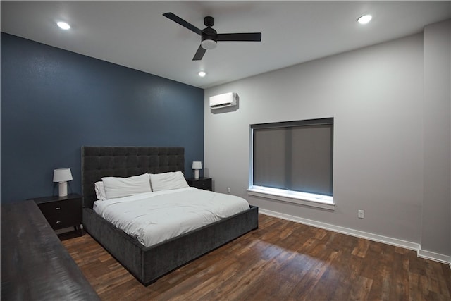 bedroom featuring a wall mounted AC, dark hardwood / wood-style floors, and ceiling fan