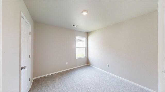 spare room with carpet floors