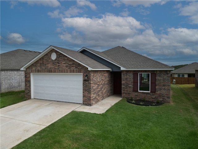 view of front of house with a garage and a front yard